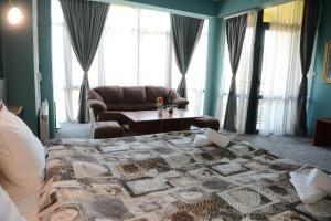 Postel nebo postele na pokoji v ubytování Family Hotel Gotse Delchev