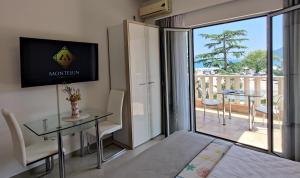 TV a/nebo společenská místnost v ubytování Montesun Residence