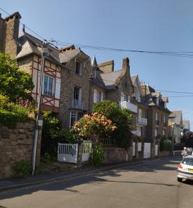a row of houses on the side of a street at LA PORTE BLEUE in Cancale
