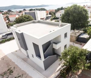 an aerial view of a white building at Apartmani Marin D&A in Zaboric