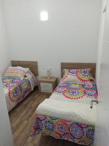 GuineaにあるVilla la cuadraの寝室に並んで置かれた2つのベッド +5枚の写真