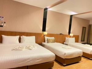 Postel nebo postele na pokoji v ubytování Manomon residence มโนมน เรสซิเดนซ์