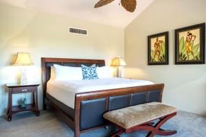 a bedroom with a bed and a chair at KBM Resorts KRO-K302 2B Villa with free Rental car in Kaanapali