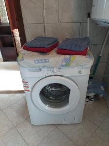 a washing machine with two towels on top of it at Apartment Romy for 2-4 people with jacuzzi in Motovun