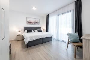 Posteľ alebo postele v izbe v ubytovaní Apartment Mint