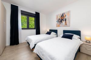 Posteľ alebo postele v izbe v ubytovaní Apartment Mint