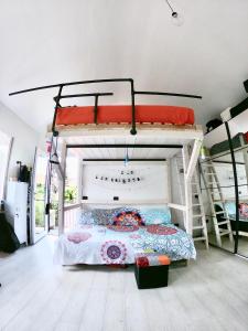 a bedroom with two bunk beds in a room at MiniLOFT con Piscina Lago di Como Lecco in Galbiate