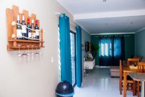 a living room with blue doors and a dining room at Home@Amalia’s in Rundu