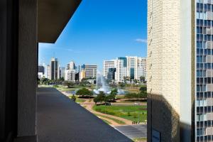 a view of a city skyline from a building at Apartamento, Nobile Suítes Monumental , localização e conforto in Brasilia