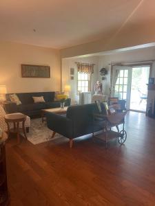 a living room with a couch and a table at Williston Village Inn in Burlington