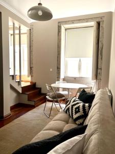 a living room with a couch and a table at Apartment Vedória in Viana do Castelo