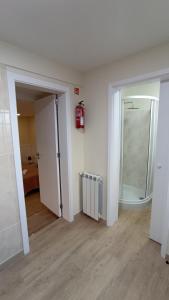 an empty room with a mirror and a radiator at A Toca in Santana +6 photos