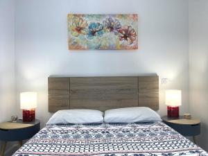 Posteľ alebo postele v izbe v ubytovaní SUNRISE BALCONY