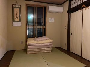 Postel nebo postele na pokoji v ubytování Hotel Lantern Gion