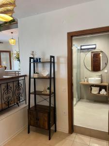 a bathroom with a shower with a glass door at Hacienda ZK in Nea Potidaea +64 photos
