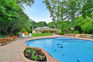 a swimming pool with a patio and a house at Amazing Pool Private Oasis! 25 Mins 2 Westhampton! in Wading River