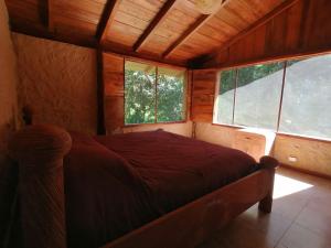 En eller flere senge i et værelse på La Chonta