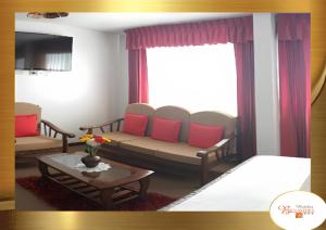 a living room with a couch and a table at Hotel Benavides in Arequipa