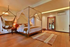 Cama ou camas em um quarto em Paraíso Ecológico Pousada & SPA
