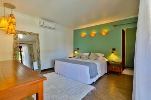 Cama ou camas em um quarto em Paraíso Ecológico Pousada & SPA