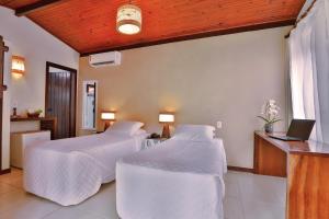 Cama ou camas em um quarto em Paraíso Ecológico Pousada & SPA