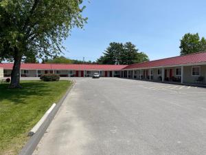 an empty parking lot in front of a building at Belmont Motel in Skowhegan