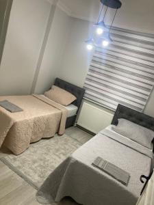Postel nebo postele na pokoji v ubytování Hk Apart Trabzon