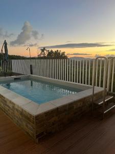 a swimming pool on top of a building at Kazadoli in Bois-Neuf