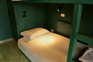 Postel nebo postele na pokoji v ubytování Casa Nomada Tuxtla Hotel - Hostal