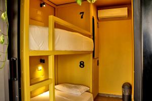 Postel nebo postele na pokoji v ubytování Casa Nomada Tuxtla Hotel - Hostal
