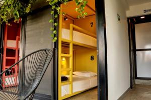 Postel nebo postele na pokoji v ubytování Casa Nomada Tuxtla Hotel - Hostal