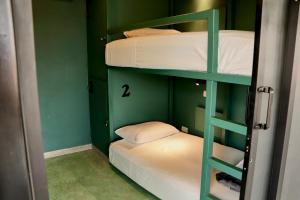 Postel nebo postele na pokoji v ubytování Casa Nomada Tuxtla Hotel - Hostal