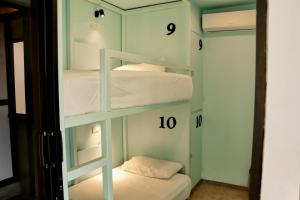 Postel nebo postele na pokoji v ubytování Casa Nomada Tuxtla Hotel - Hostal