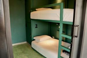 Postel nebo postele na pokoji v ubytování Casa Nomada Tuxtla Hotel - Hostal