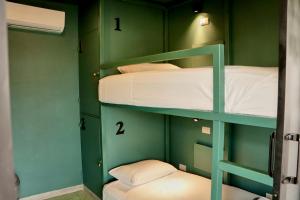Postel nebo postele na pokoji v ubytování Casa Nomada Tuxtla Hotel - Hostal