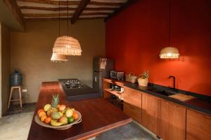 a kitchen with a bowl of fruit on a counter at CASA JUANA BARICHARA in Barichara