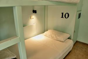 Postel nebo postele na pokoji v ubytování Casa Nomada Tuxtla Hotel - Hostal