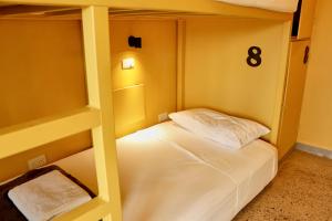 Postel nebo postele na pokoji v ubytování Casa Nomada Tuxtla Hotel - Hostal