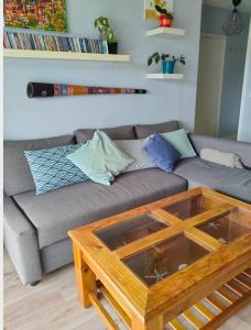 a living room with a couch and a coffee table at Hendaya vistas increíbles in Hendaye +5 photos