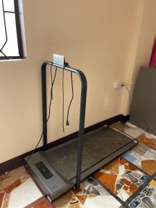 a treadmill on the floor in a room at Maria Kulafu Lodging House Pier site- Santa Clara office 2nd Floor 