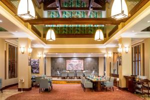 a large banquet hall with tables and chairs in a room at Sheraton Hanoi Hotel in Hanoi