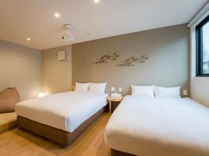 A bed or beds in a room at Rakuten STAY VILLA Yatsugatake - 107 Simple Modern -