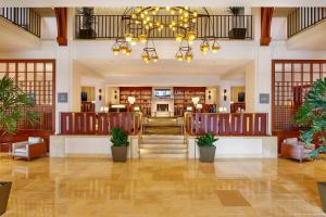 a lobby of a hotel with a staircase and a building at The Westin Pasadena in Pasadena