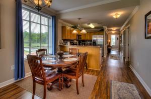 a kitchen and dining room with a table and chairs at River Crossing #405 in Pigeon Forge