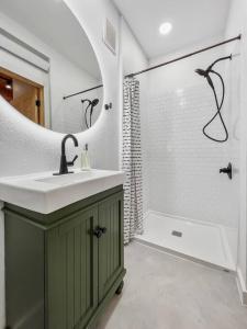 a bathroom with a sink and a shower at Guest Suite-Hot Tub-Close to Town in Rapid City