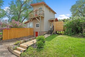 a house with a balcony on top of it at Guest Suite-Hot Tub-Close to Town in Rapid City