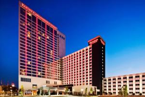 two tall buildings with red lights on them at Sheraton Greensboro in Greensboro