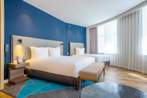 Holiday Inn Express Urumqi Station by IHG客房内的一张或多张床位