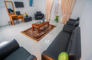 TV a/nebo společenská místnost v ubytování العاصمة للشقق الفندقية - Capital Hotel Apartments