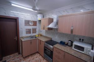 Kuchyň nebo kuchyňský kout v ubytování العاصمة للشقق الفندقية - Capital Hotel Apartments